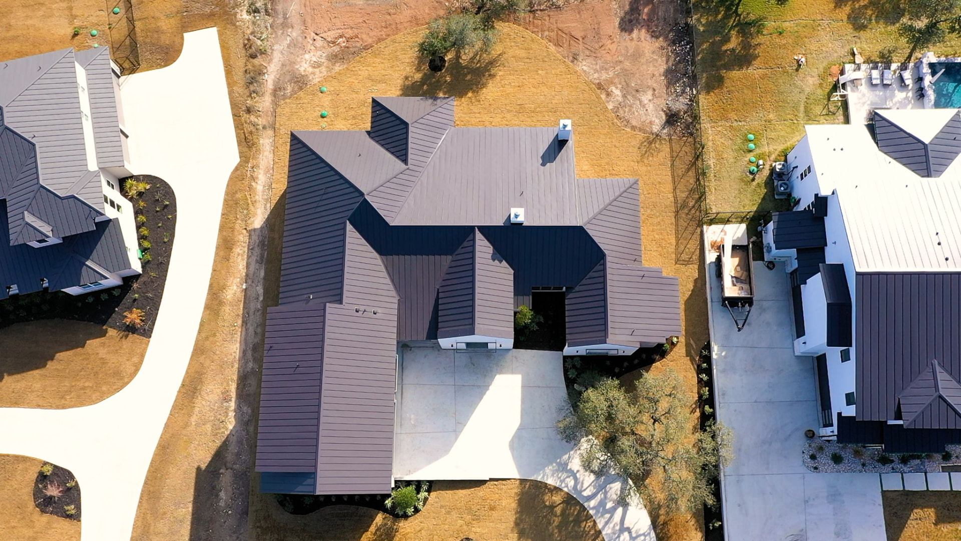 Aerial view of the standing seam metal roof and drive at The Canyons
