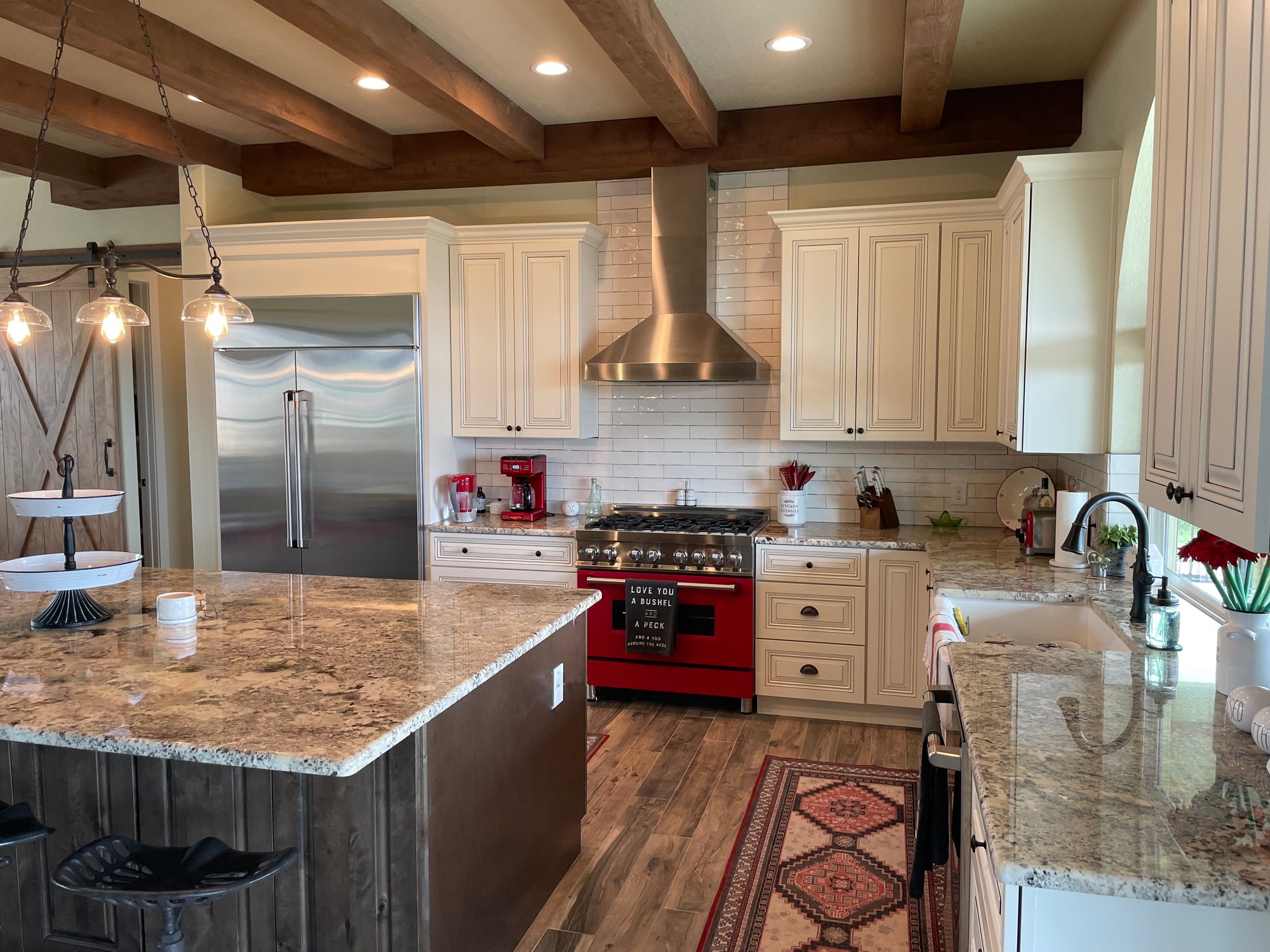 Finished custom kitchen with island and pendant lighting