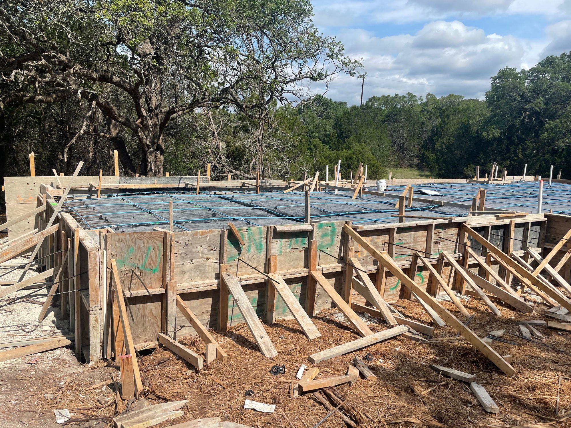 Foundation forms and rebar set before a concrete pour on a Texas job site